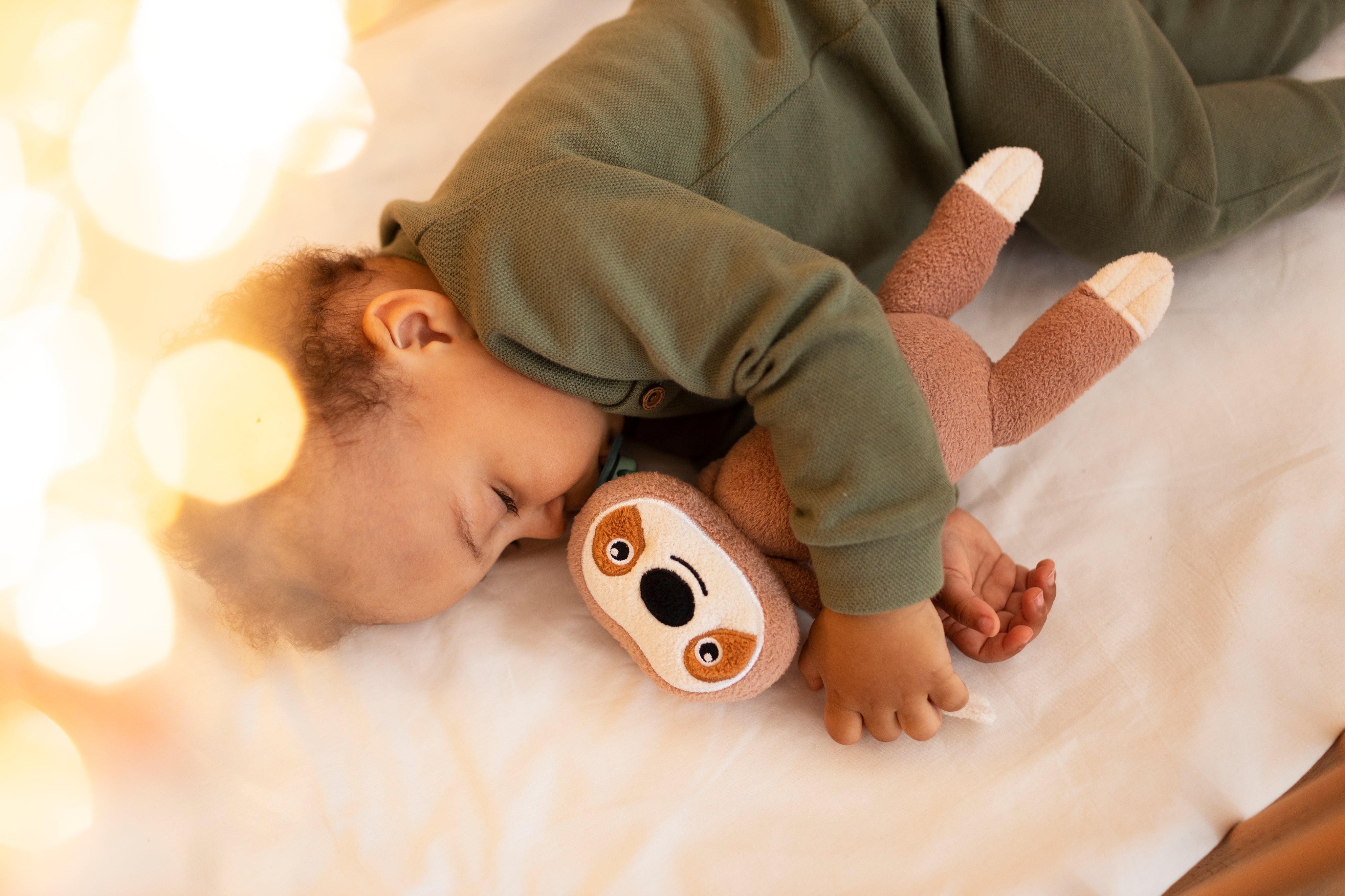Top View of Baby With Stuffed Toy