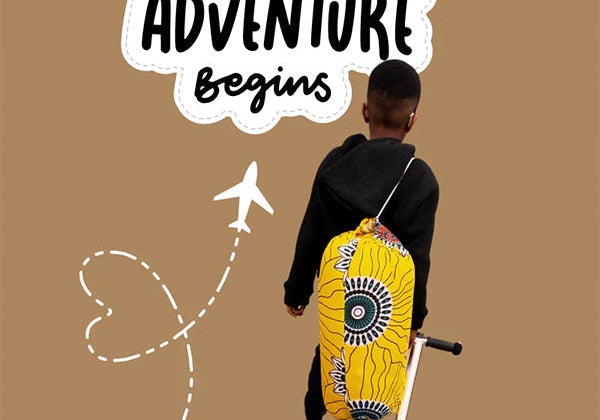little boy boarding an airplane with a Sinzia nap mat and backpack.